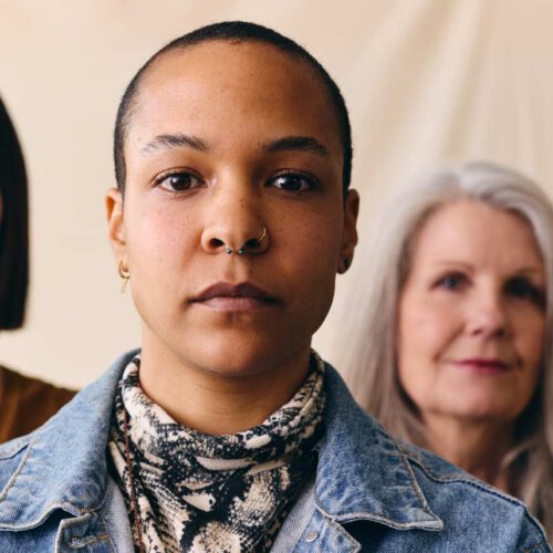 Group of diverse women standing together facing the camera